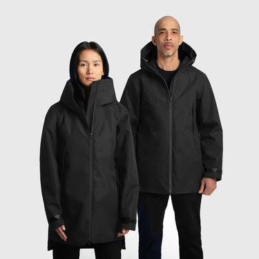 Two people wearing black raincoats on a white background