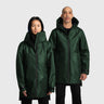 A male and a female model wearing green raincoats on a white background