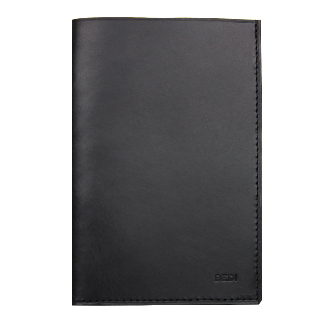 Front view of minimalist passport wallet in black upcycled leather