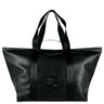 A large weekender bag made with black vegan leather, and with black straps made from seatbelts