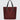 A red nylon tote bag with black medium-length straps and a black patch with gold logo text