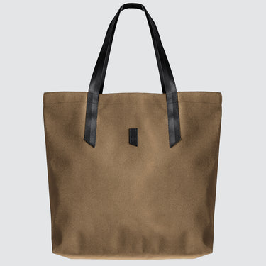 tan tote bag with black handles on a light grey background
