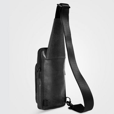 A black leather crossbody bag with an adjustable black webbing strap, shown from a side profile view against a light gray background.